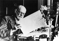 Freud with the manuscript of "Moses and Monotheism"